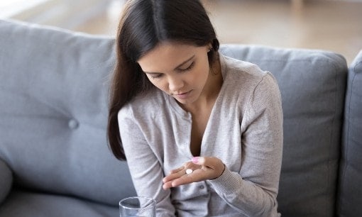 Image of patient taking medication